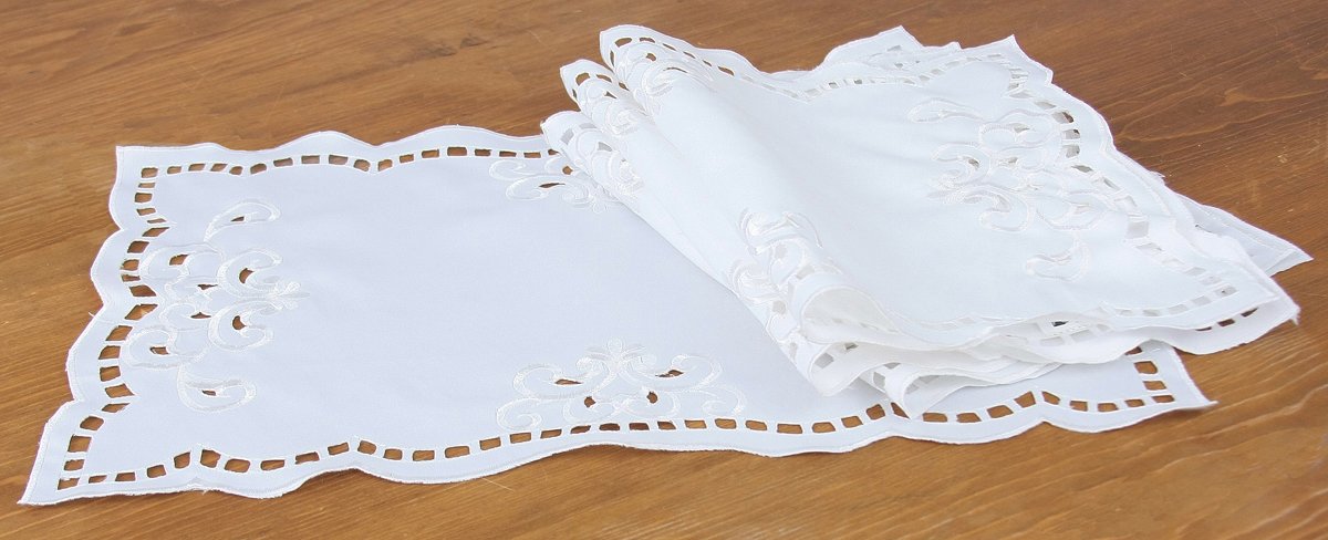 Set of 4 XD80506A Hampton Placemats featuring elegant cutwork and embroidery in white and ivory colors.